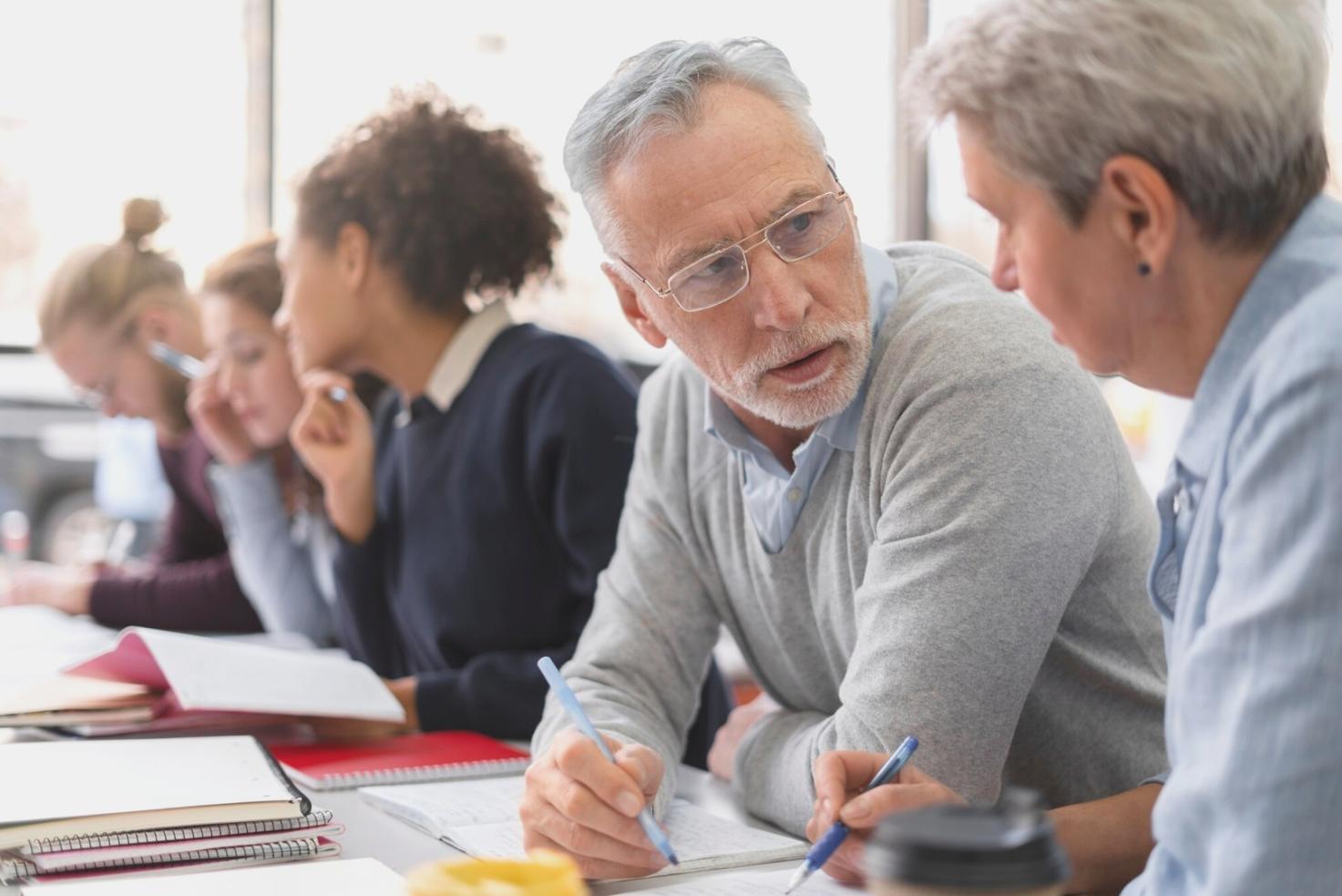 Business owner reviewing financial reports and surplus allocation strategies